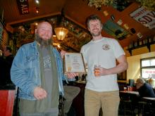 Colchester CAMRA&#039;s Trevor Johnson presented the certficate to Chris Riches, Brewery Manager of the Fat Cat Brewery.